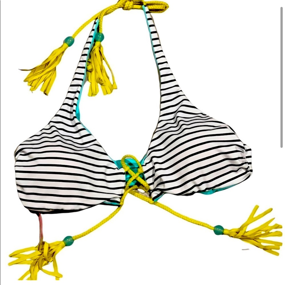 VS strips and turquoise with lime green. It is Reversible Bikini Top size large